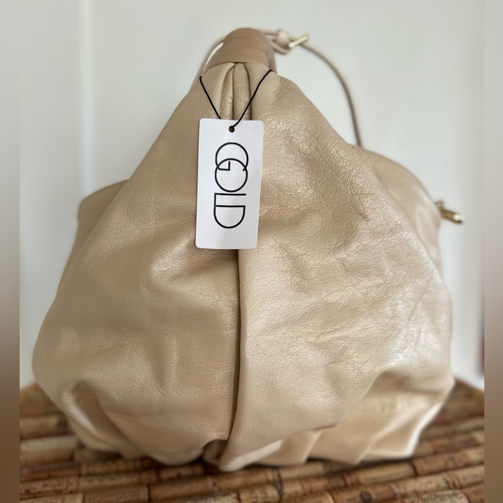 NWT gorgeous gold leather handbag. Detachable shoulder strap. Gold and beige